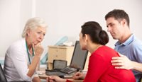 GP speaking to patient. 